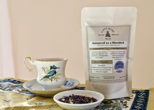 back of the label of tea with a tea cup and looseleaf tea