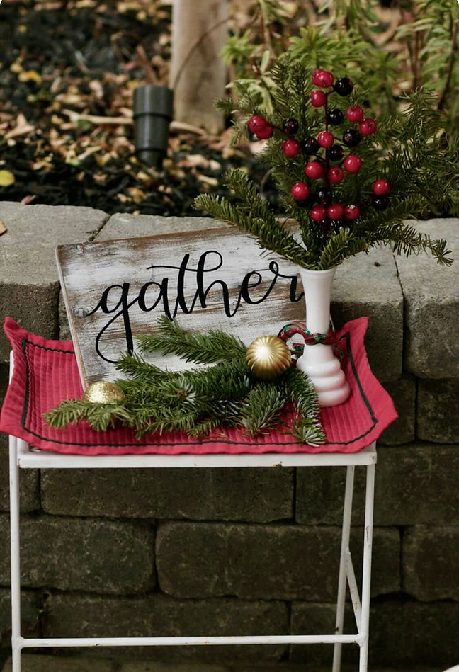 gather farmhouse sign with christmas decor on stand