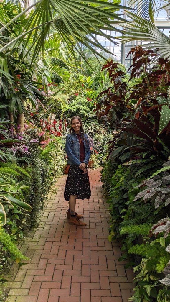 woman walking through conservatory at Biltmore Estate