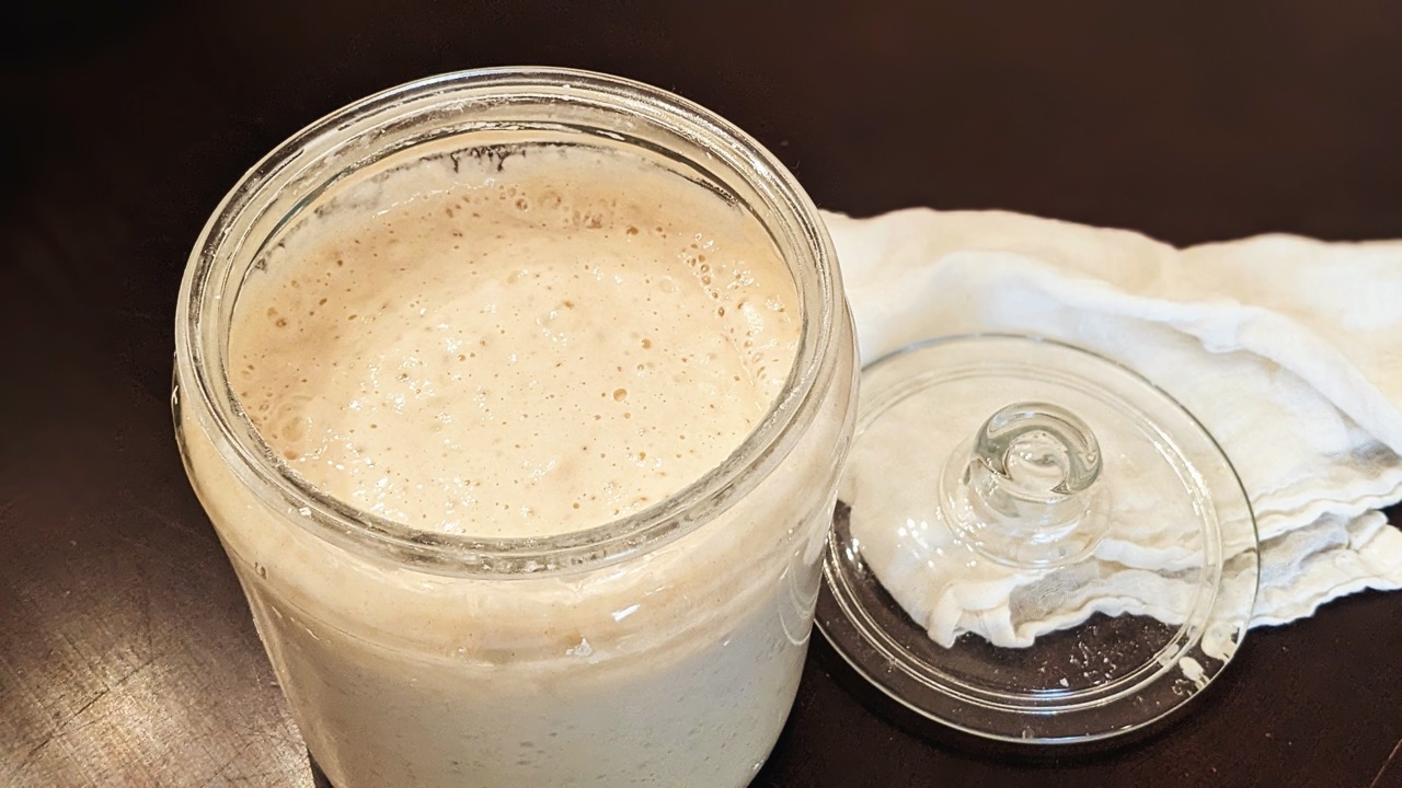 sourdough starter in a glass jar with a lid