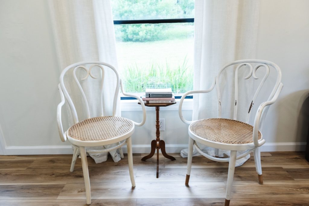 sitting area with two chairs and books