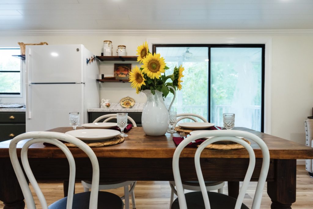 table set with place settings and sunflowers